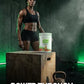 Woman standing next to a protein powder container with text about sustained muscle endurance on a dark background.