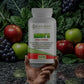 Knockout Men's Daily Vitamin bottle held in front of fruits and vegetables with text about science-backed vitality.