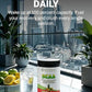 BCAA supplement bottle on a table with a cityscape view, lemon slices, and water.